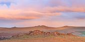 King Tor lit by the rising sun