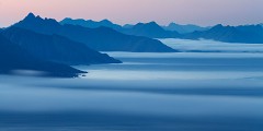 Sea mist drifts south from Lofoten into the Norwegian sea at night