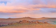 King Tor lit by the rising sun