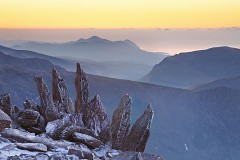 spikey rocks of glyder fawr lits but twilight in the winter