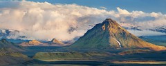 Hattfell rises above the dramatic plains of Iceland with big clouds behind
