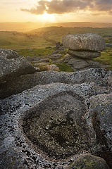 The sun sets behind Roos Tor witha  view over west Devon