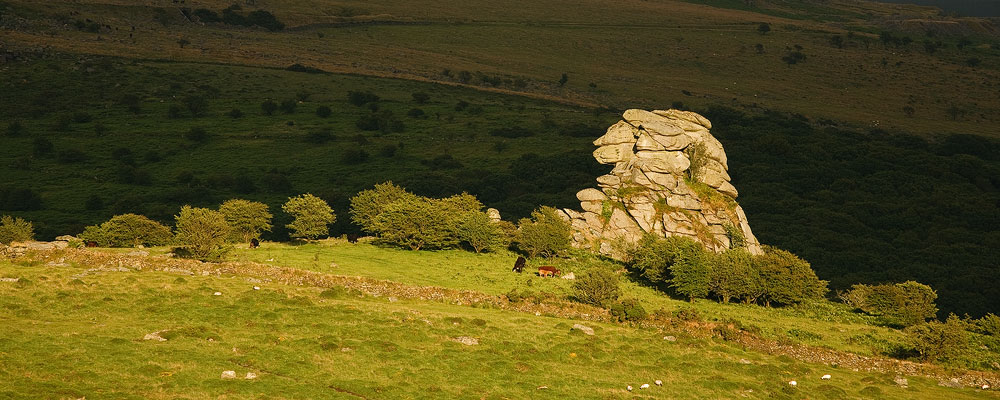 Stong sunlight hits Vixen Tor on Dartmoor