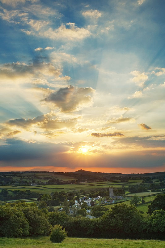 sunrays burst between the clouds over Peter Tavy in Devon
