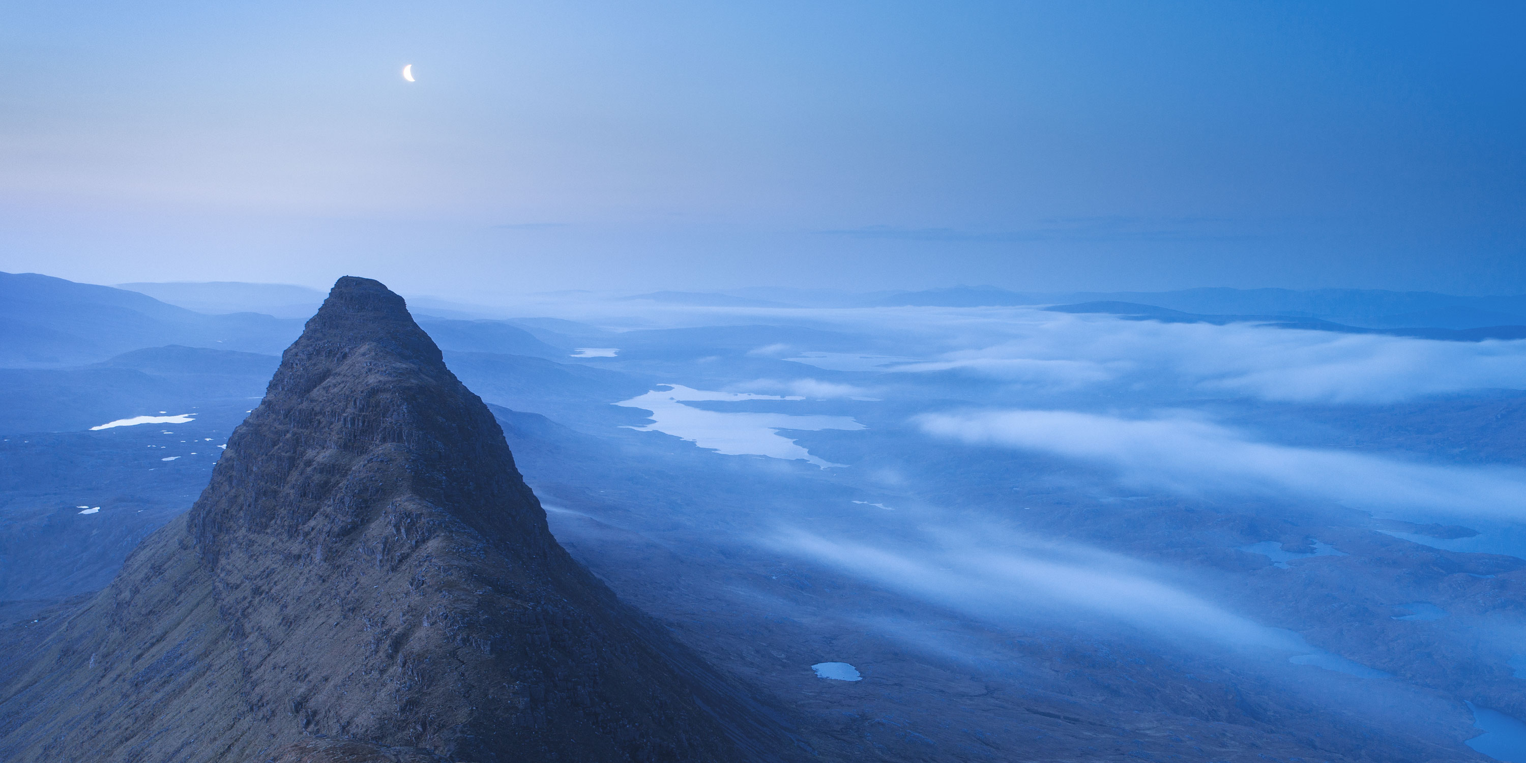 Meal Meadonach from Suilven before sunrise with a crescent moon overhead